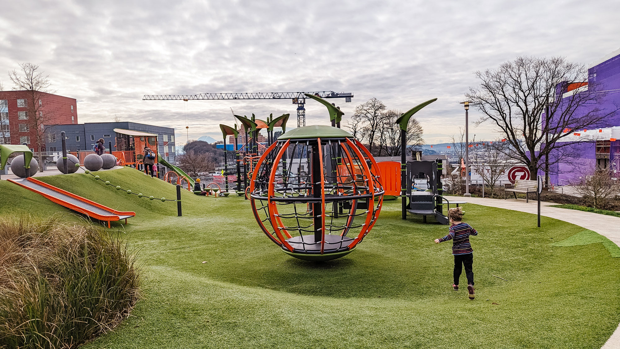 A vibrant urban playground inviting exploration, perfectly located for your next family transit adventure.